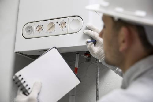worker-repairing-water-heater (1).jpg